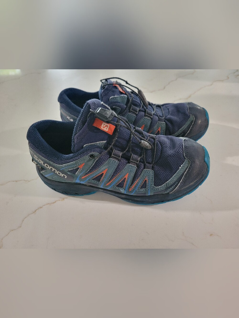 Salomon Navy Blue Sneakers with Teal and Orange Accents